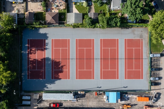 The Shorewood High tennis team practices hard on the tennis courts.