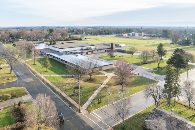 Whitewater Middle School has expansive green spaces for sports and outdoor activities.