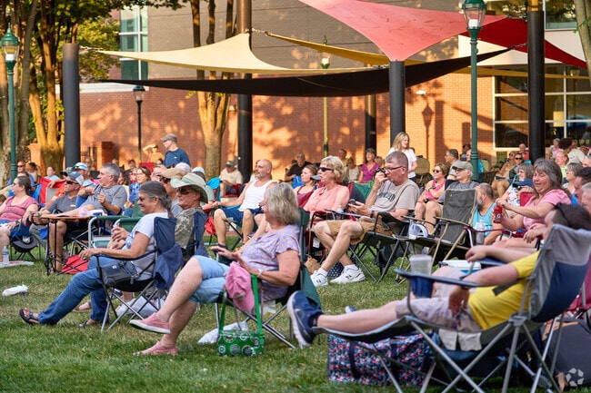 A large crowd enjoys music on a summer evening in University Plaza, Hagerstown.