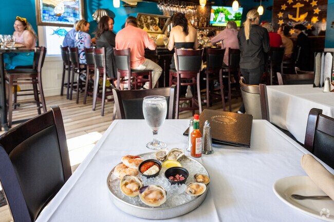 Indulge in fresh oysters at Greenwich Bay Oyster Bar in Nichols Corner, RI.