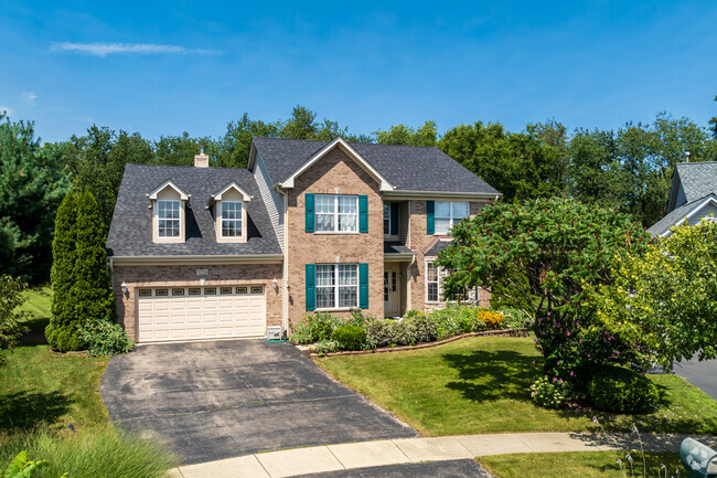 21st-century New Traditional-style homes line its Renaux Manor subdivision of Rainbow Hills.