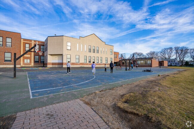 Students enjoy playing basketball on two courts behind Winn Brook Elementary School in Belmont.