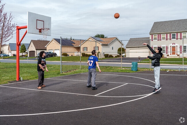 West Catasauqua teens take time after school for an afternoon pickup basketball game.