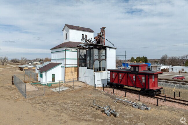 The grain elevator which still stands west of the railroad tracks was constructed in the early 1900s.