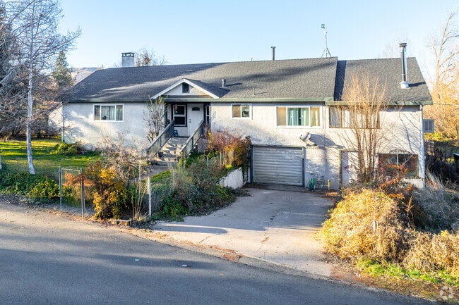 Raised ranch-style homes offer front walkways in Fall River Mills.