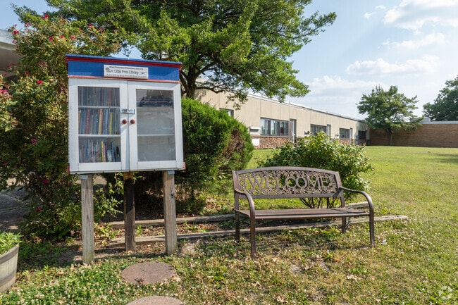 Enjoy a book from the Little Free Library at Albert Schweitzer Elementary School.