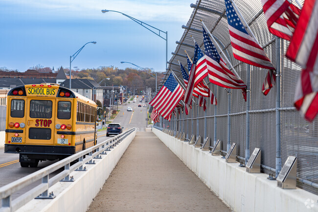 American flags wave above Vietnam Veterans Memorial plaques in West Massillon.