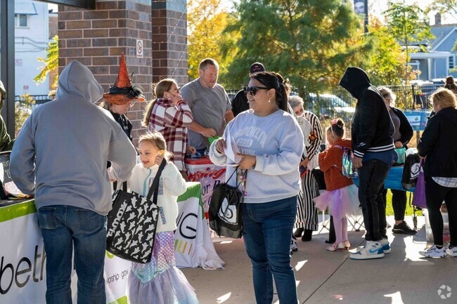 Families gather for Lansing’s annual Halloween Trick or Treat event.