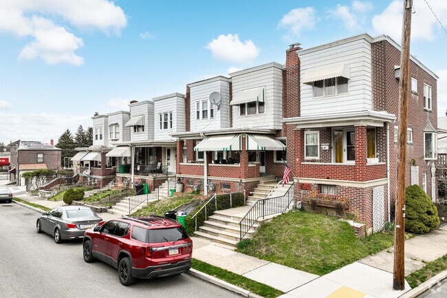 Many of these brick rowhomes in Rittersville feature awnings to cut down on cooling costs.