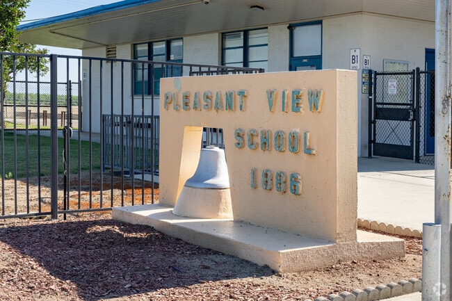 An antique school bell is featured at the entrance to Pleasant View Elementary School.