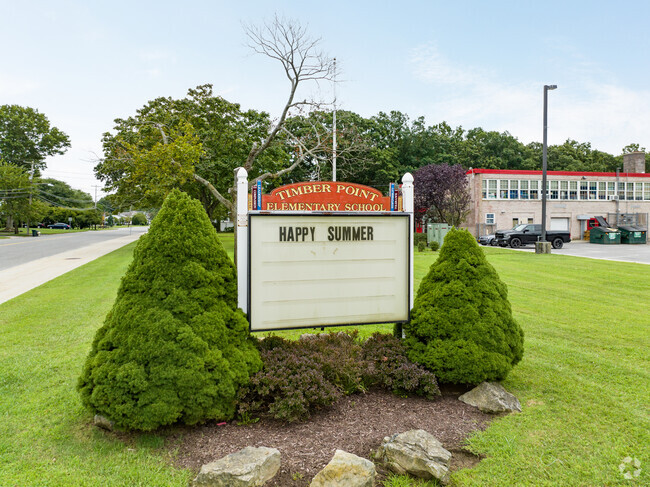 Timber Point Elementary School sign in the front of the school.