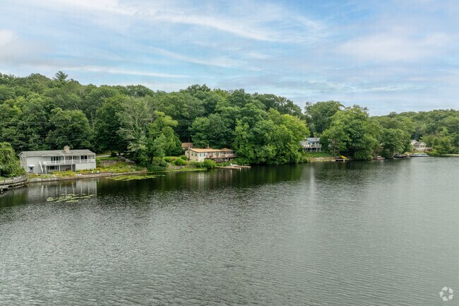 Several homes line the shore of Long pond in North Stonington.