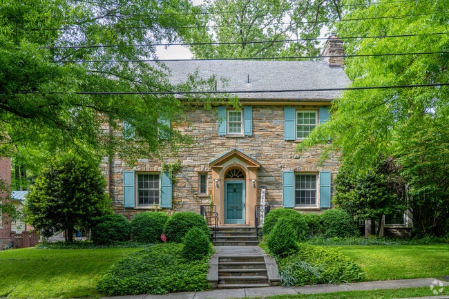 An elegant stone colonial home on East Beach Drive NW in Colonial Village.