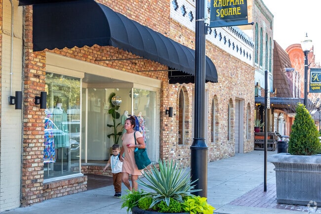 Shops and restaurants line up Kaufman's downtown square for people to enjoy a leisure walk.