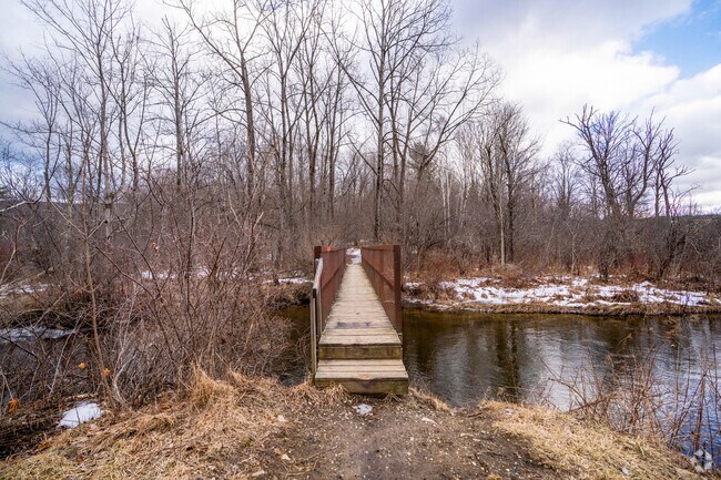 A narrow bridge on a hiking trail crosses a tributary of the Walloomsac River in Bennington.