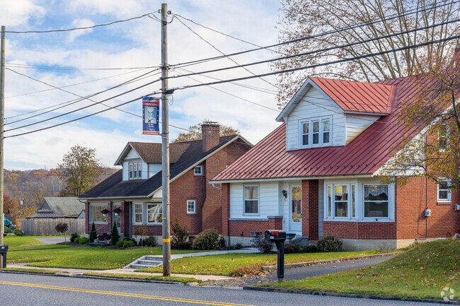 Two bungalow style homes along the main road in to Centerport Borough.