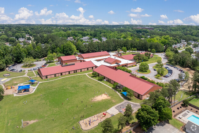 Findley Oaks Elementary School features a large green space and playground for the students to enjoy.