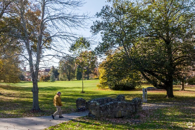 Wilcox Park offers dog and family friendly walking trails through a pond and green space area.