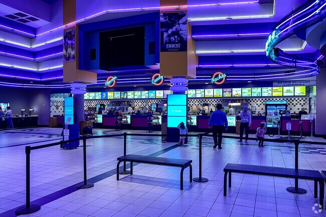 Cinema 18 is located in the nearby shopping mall featuring blue LED lights.