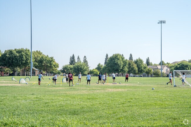 Kids are playing soccer at Witter Ranch Park in the Gateway West Neighborhood.