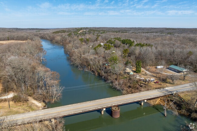 The Little Red River, a popular fishing destination, flows east through Searcy.
