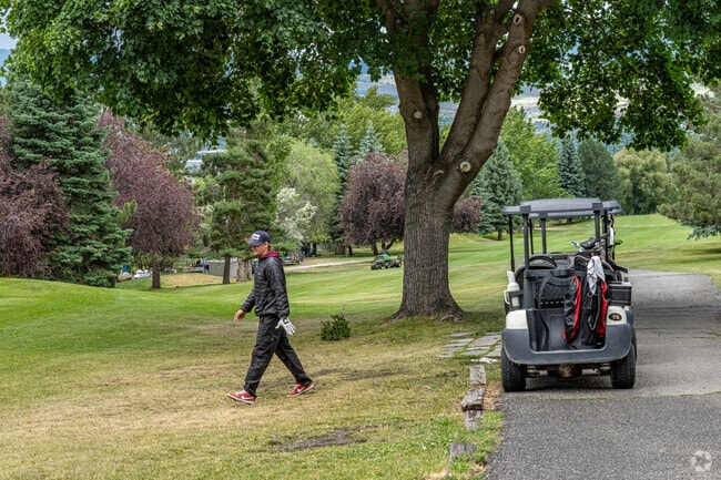 Golfers enjoy challenging holes and well-manicured greens at The Highlands Golf Club.