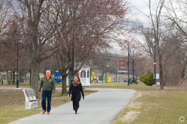 People enjoying a stroll in Corning Park on the Hudson River just outside Sheridan Hollow.