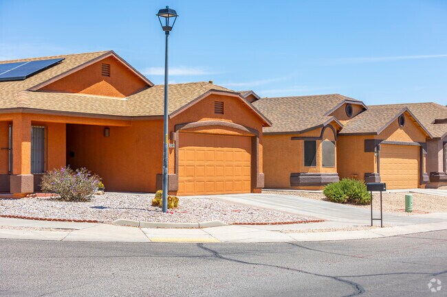 In Tres Pueblos, homes blend modern design with Southwestern charm, featuring stucco exteriors and red-tiled roofs that reflect the area's rich cultural heritage.