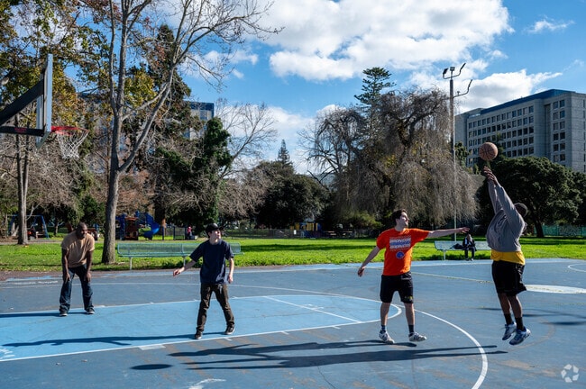 Oakland residents play a game of hoops in Mosswood Park.