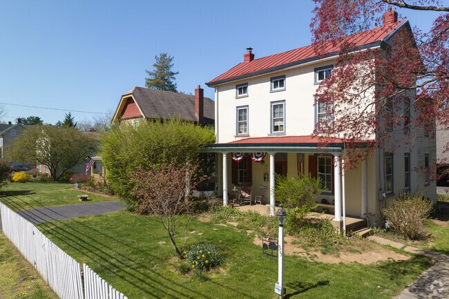 An old farmhouse-style home stands in Flourtown.