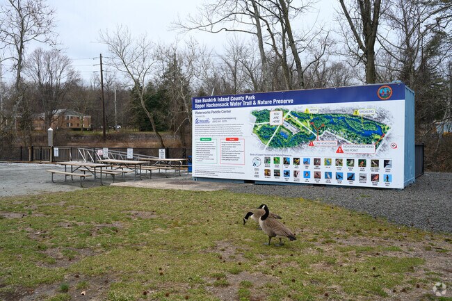Signage at Van Buskirk Island County Park displays a map and birdwatching information.