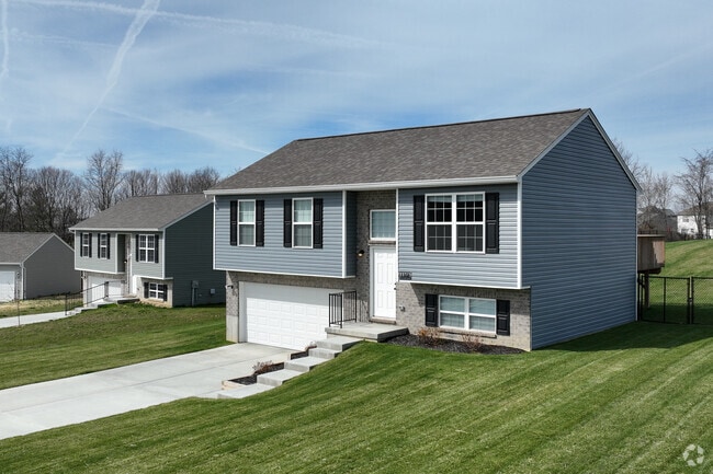 Streets are quiet, tree-lined and gently sloped in Independence such as these Split-Levels.