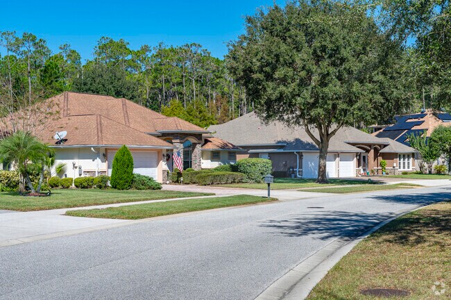 Mature trees and manicured lawns are commonplace in the Pine Trails neighborhoods.