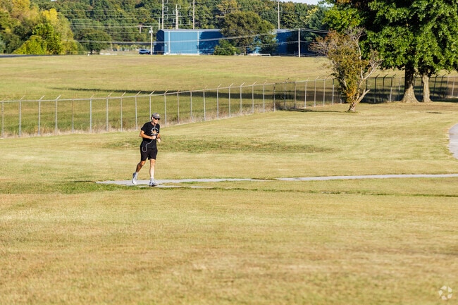 Runners enjoy chasing miles on the paved trails at Cooper Park.