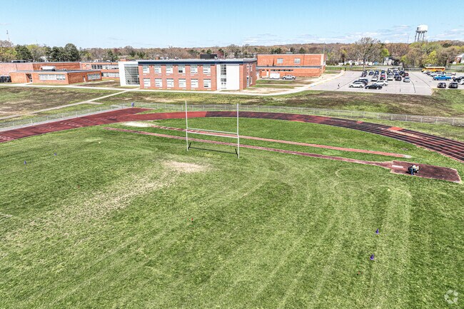 The Ralph G. Reed Middle School  football field is in close proximity to the parking lot.
