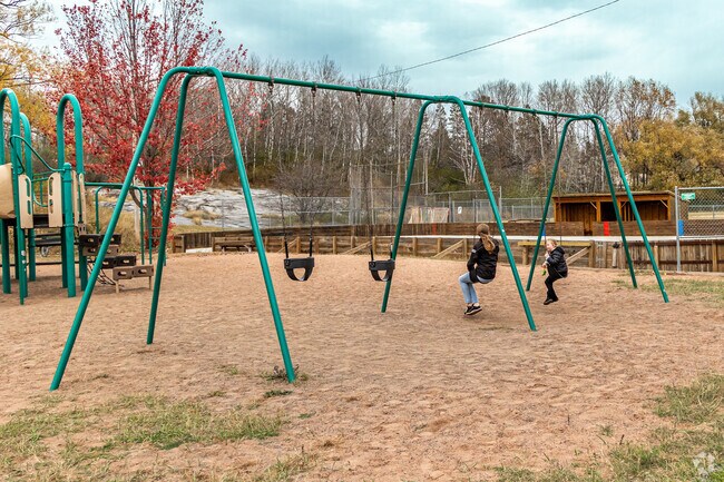 Kids enjoy the swings at Duluth Heights Park.