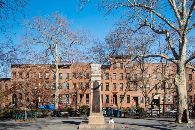 Carroll Park monument statue stands tall in the center of the park.