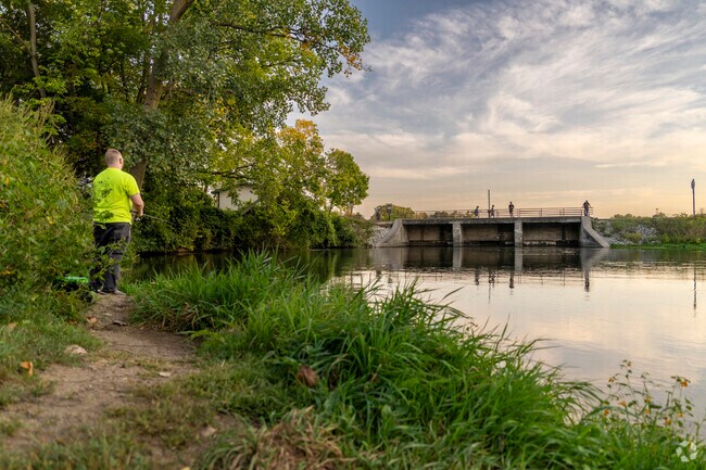 Historic Racemere Peninsula locals go fishing at the Goshen Pond Dam after work.