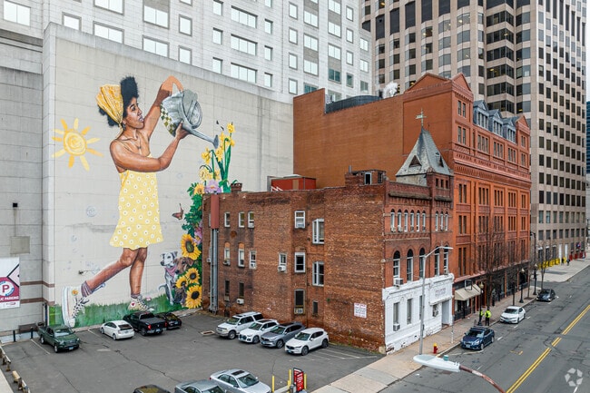 Just Grow is painted by muralist Corey Pane. Downtown Hartford features several large murals.