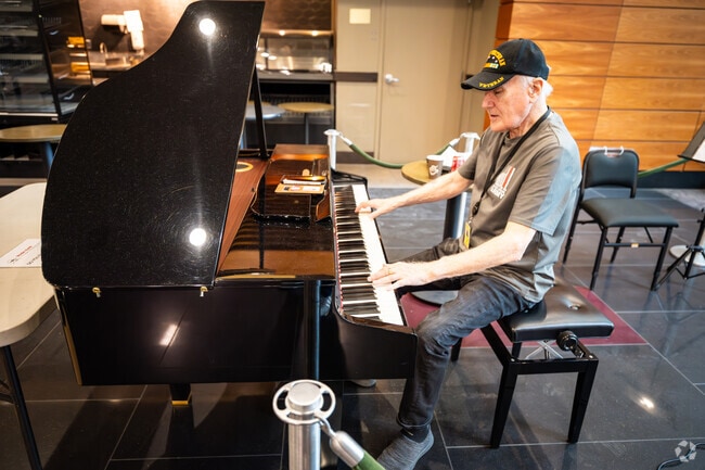 At T.F. Green International Airport in Rhode Island, a U.S.A. veteran plays the piano.