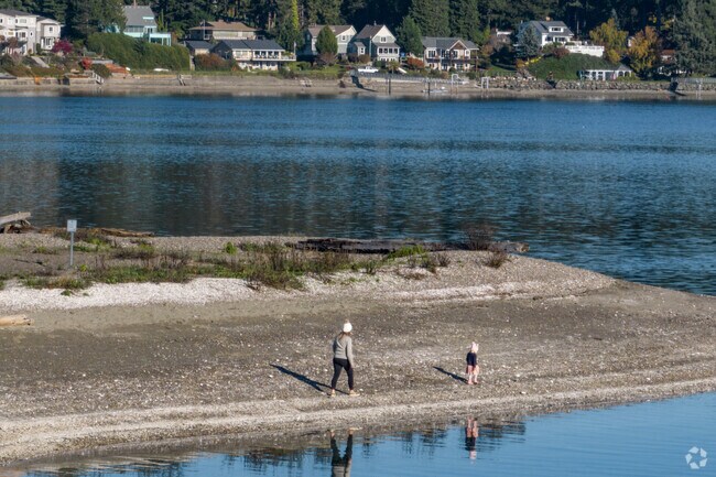A mother and daughter enjoy a walk along the Tacoma DeMolay Sandspit Nature Preserve.