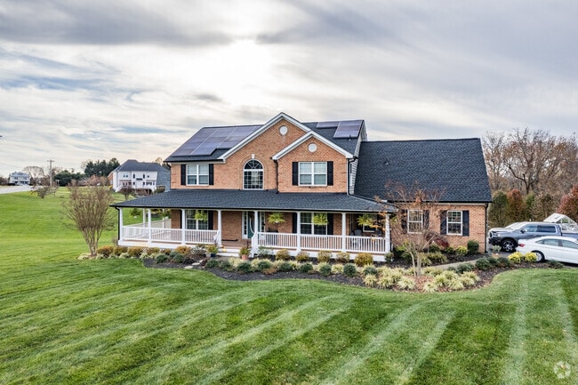 The allure of Owings colonial homes, each adorned with front porches for a touch of hospitality.