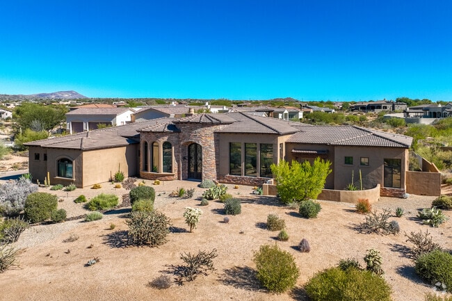 Desert Mountain homes are typically covered in stucco with brick and stone accents.