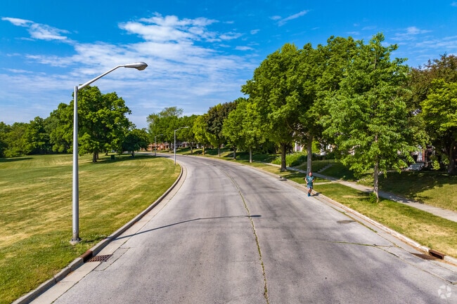 A jogger running through the Kinnickinnic River Parkway and oak Leaf Trail in Fairview.