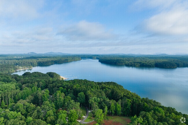 Lake Allatoona's picturesque water has shimmering turquoise hues that reflect trees and skies.