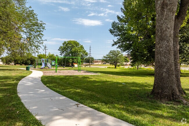 Take a stroll on the paved path that weaves through Gwendolyn Brooks Park.