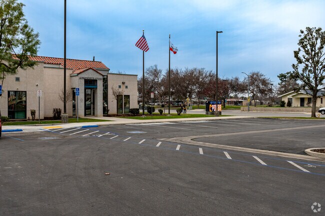 The flags fly high in front of Wasco Independence High School.