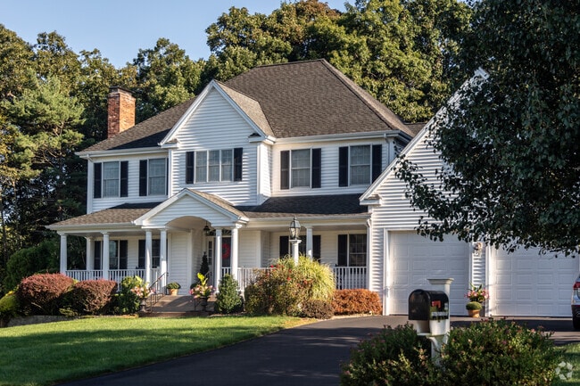 Oaks and maples provide a scenic backdrop for Colonial Revival homes in Glastonbury Center.