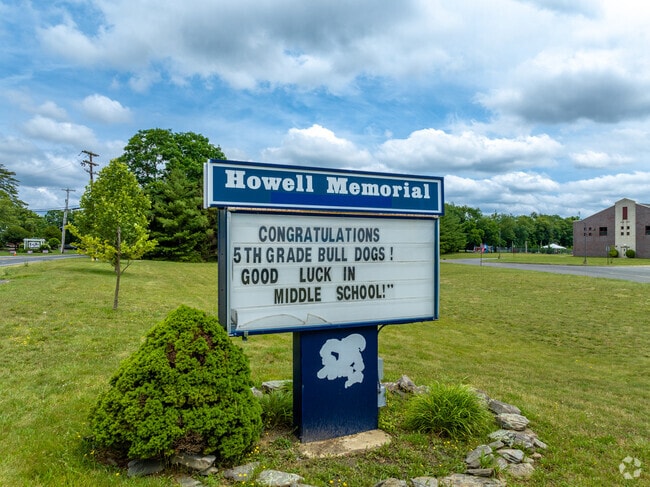 The Memorial Elementary School sign welcomes students and staff in Freehold Township, NJ.