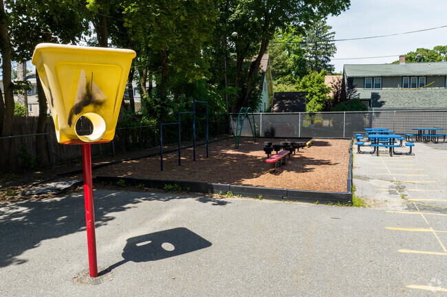 Students can play or sit and eat a snack during recess at Midland Street School.
